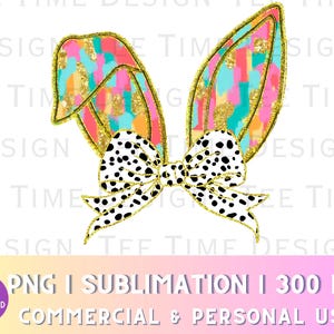 May include: A pair of pink and blue bunny ears with a black and white polka dot bow. The ears are decorated with gold glitter and have a watercolor-like design.
