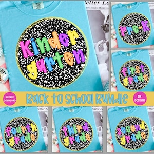 May include: A light blue t-shirt with a colorful "Kindergarten" graphic on the front. The graphic is a circle with a black and white speckled background and the words "Kindergarten" in bright, playful colors. The image also shows shirts for other grades.