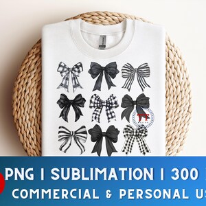 May include: A white t-shirt with a design of nine black and white bows. The bows are arranged in three rows of three. The design is perfect for sublimation.