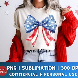 May include: Cream-colored t-shirt featuring a watercolor bow design in red, white, and blue, with a star pattern on the blue sections. The shirt is part of a patriotic theme, perfect for Independence Day celebrations.