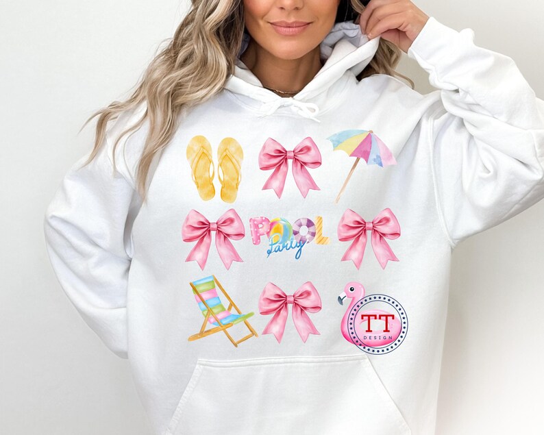 May include: White hoodie with a pink flamingo, beach chair, flip flops, bow, and umbrella design. The text "Family Pool Party" is printed on the hoodie.