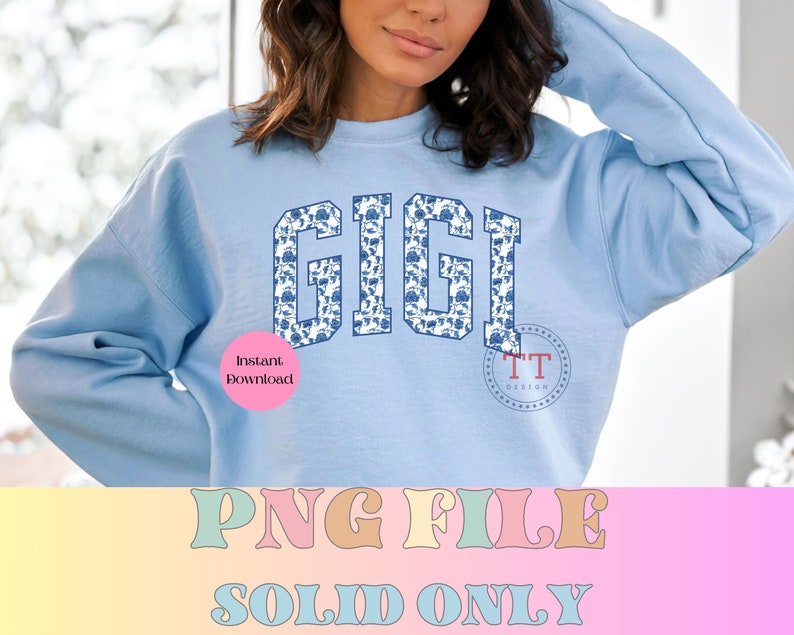 May include: A light blue sweatshirt with the word "GIGI" printed in blue and white on the front. The letters are outlined in navy blue and filled with a white and blue floral pattern. The text "Instant Download" is visible in the lower left corner of the image.