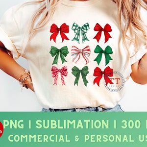May include: A white t-shirt with a design of nine red, green, and white bows. The bows are arranged in a grid pattern. The text "TT Design" is in the lower right corner of the shirt.
