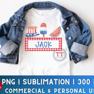 May include: A white t-shirt with a red, white, and blue Fourth of July themed design. The design includes a watermelon slice, a popsicle, and a hat with a star on top. The text "JAGK" is on a red and white checkered background.