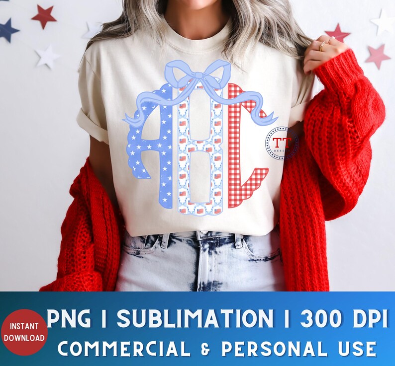 May include: A cream-colored t-shirt featuring a patriotic monogram design with the letters "AHC". The "A" is blue with white stars, the "H" has a pattern of red, white, and blue flags, and the "C" is red gingham. A blue bow tops the design.