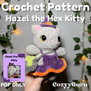 May include: A crocheted gray cat doll named Hazel the Hex Kitty, wearing a purple dress with orange trim and a witch hat. The doll has large, glittery eyes and a small green bag. The image includes text that says "Crochet Pattern" and "PDF ONLY".