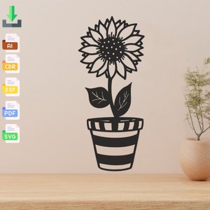 May include: Black and white silhouette of a sunflower in a striped pot. The sunflower has a large head with many petals and a centre filled with small dots. The pot has a wide base and a narrow top.