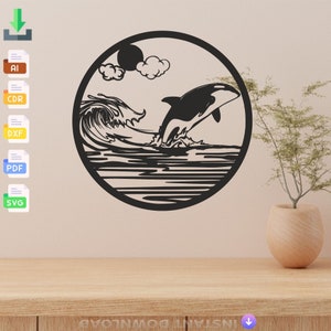 May include: Black and white silhouette of an orca jumping out of the water with a wave behind it. The orca is in a circle with a sun and clouds in the background.