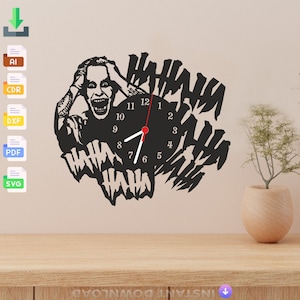 May include: Black and white clock featuring a silhouette of the Joker from the Batman movie, with the words "HAHAHA" repeated around the clock face.