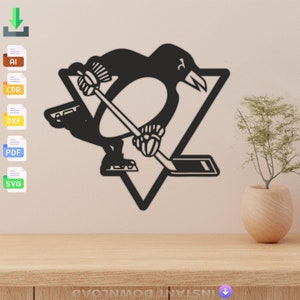 May include: Black and white silhouette of a penguin holding a hockey stick, standing on a triangle. The penguin is wearing a jersey with a letter "P" on the front. The image is a logo for a hockey team.