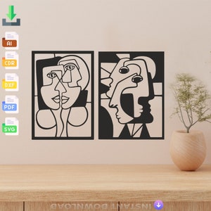 Puede incluir: Dos impresiones de arte abstracto en blanco y negro con rostros estilizados. Las impresiones están enmarcadas en negro y están colgadas en una pared beige claro.