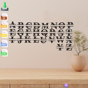 May include: Black decorative alphabet letters, each split horizontally with ornate flourishes, are displayed on a wall. The letters are arranged in alphabetical order. A small vase with greenery sits on a wooden surface.