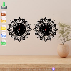 May include: Two black clock faces with Roman numeral and Arabic numeral markings, set against a white wall. Both clocks are surrounded by a black mandala design.