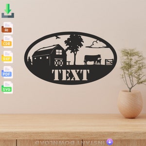 May include: Black and white silhouette of a farm scene with a barn, trees, cows, and a fence. The text "TEXT" is below the scene in a white oval.