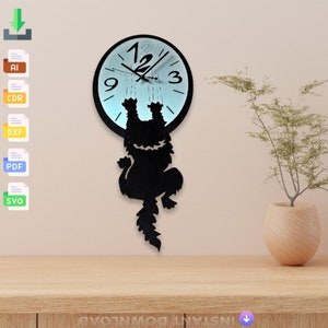 May include: A black cat silhouette clock with a blue clock face and white numbers. The cat is hanging from the clock face and has a long tail.