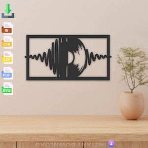 May include: Black metal wall art featuring a stylized vinyl record with sound waves. The record is partially cut out to reveal the center hole. The art is framed in a black rectangle.