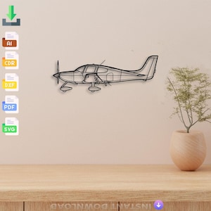 May include: Black metal airplane wall art. The airplane features a propeller, wings, and a detailed fuselage. The artwork is mounted on a light beige wall, with a small plant in a vase to the right.