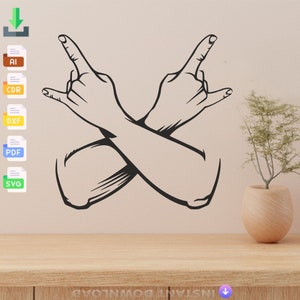 May include: Black line art of two crossed arms with hands making the 'I love you' sign. The design is on a light beige background, with a wooden table in the foreground. A small plant in a wooden pot is on the right.