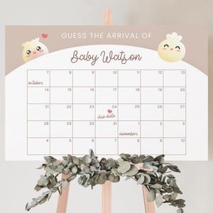 May include: A printable baby shower game with a calendar for guests to guess the baby's due date. The calendar is decorated with cute cartoon dumplings and the text "Guess the arrival of Baby Watson".