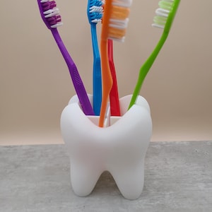 Toothbrush Holder: Quirky Tooth-Themed Bathroom Decor