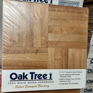 May include: A package of Oak Tree I 12" x 12" tongue-and-groove parquet flooring. The flooring is made of solid hevea hardwood with a durable ultracrylic finish. The color is chestnut.