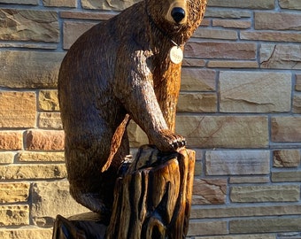 Bear chainsaw carved standing on all fours . Named “ Happy” Wood carved,one of a kind, unique,Pawlownia wood