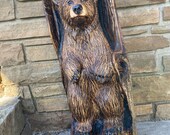 Bear in log chainsaw carving ,sculpture ,realistic looking, Aiden.