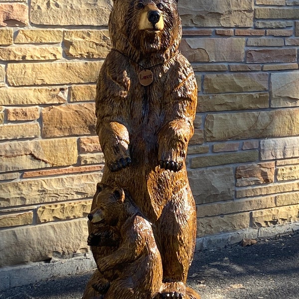 Bear chainsaw carved standing with two bear cubs at her feet named “Love.” Wood carved,one of a kind, unique,Pawlownia wood