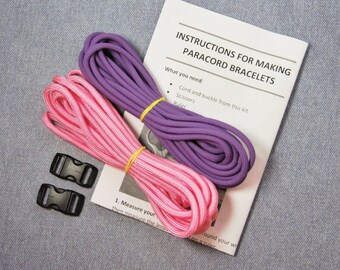May include: Instructions for making paracord bracelets with pink and purple cord, two black plastic buckles, and a ruler.  "Cord and buckle from this kit, scissors, ruler."