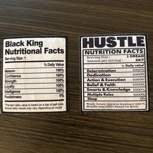 May include: Two rectangular patches with black text on a white background. One reads "Black King Nutritional Facts" with a list of attributes. The other says "Hustle Nutrition Facts" with a list of attributes. Both have a black border.