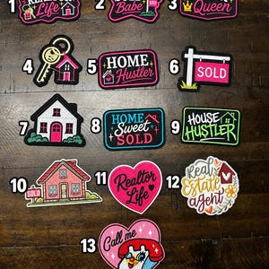 May include: A collection of thirteen embroidered patches featuring real estate themes. Designs include text like Realtor Life, Sold Babe, Offer Queen, Home Hustler, House Hustler, Home Sweet Sold, and Real Estate Agent, alongside house and key icons.