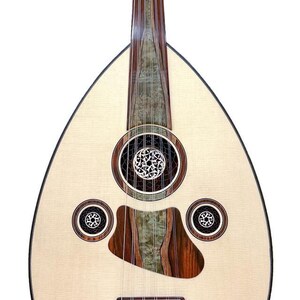 May include: A light-coloured oud, a Middle Eastern stringed instrument, with a pear-shaped body. The instrument features a light wood face with decorative sound holes and a dark wood neck and accents. The oud is displayed on a black stand.