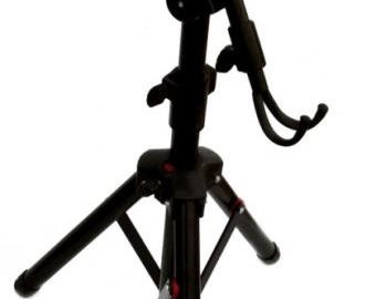 May include: Black tripod stand with a black adjustable arm and a phone holder. The stand has three legs and a red adjustment knob.