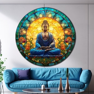 May include: A stained glass round wall art featuring a meditating Buddha in a blue robe surrounded by colorful flowers and leaves.