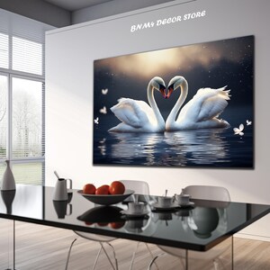 May include: Two white swans with their necks intertwined in the shape of a heart, floating on a dark blue lake with a starry sky and a golden sunset in the background.  The swans are reflected in the water.