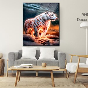 May include: A white tiger with orange stripes stands on a snowy landscape with a starry night sky in the background. The tiger is glowing with a warm orange light.