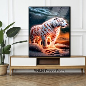 May include: A white tiger with orange stripes stands on a rocky path in a snowy landscape. The tiger's eyes glow with a fiery orange light. The background is a dark blue sky with stars.