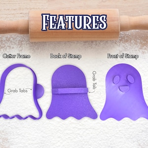 May include: A wooden rolling pin with the word "FEATURES" in blue and white text. Three purple ghost-shaped cookie cutters are displayed, labeled "Cutter Frame", "Back of Stamp", and "Front of Stamp". The cutters have grab tabs.