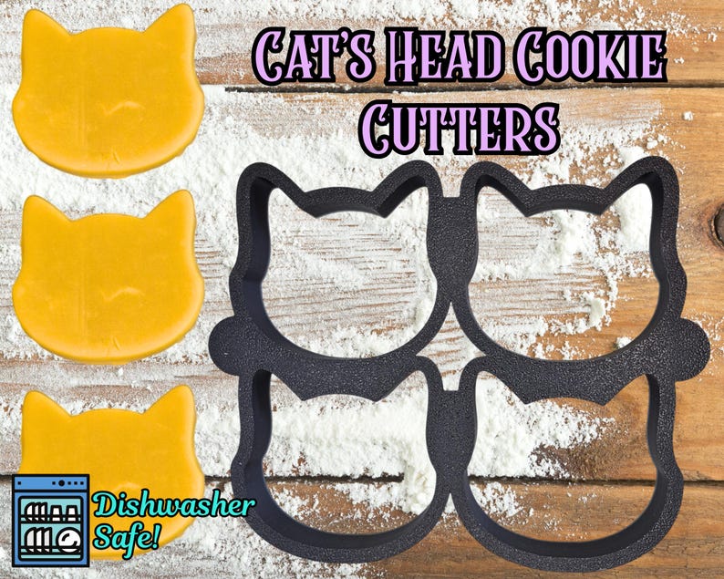 May include: Image of cat-shaped cookie cutters and cookies. The black plastic cutters are in the shape of a cat's head. Three yellow cookies are also visible. Text reads "Cat's Head Cookie Cutters" and "Dishwasher Safe!"