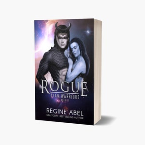 May include: Book cover featuring a fantasy romance novel titled "Rogue" with a subtitle "Kian Warriors Book 11" by author Regine Abel. The cover features a dark-skinned male character with horns and a blue-skinned female character with long dark hair. The background is a dark blue and purple galaxy with stars.