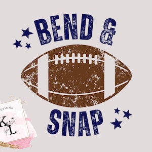 May include: A distressed brown football graphic with white stripes and laces, the words "BEND & SNAP" in navy blue, and navy blue star accents. The image has a vintage, textured look, perfect for sports fans.