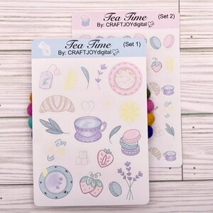 May include: A white ceramic mug with a black handle and the text "But First, Coffee" in a black, bold font. The mug is on a white surface.