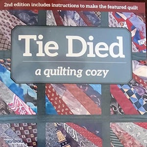 May include: Book cover with the title "Tie Died: a quilting cozy" and the author's name "Carol Dean Jones". The cover features a patchwork quilt made from colorful neckties.