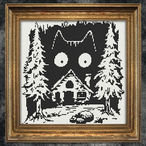 May include: Black and white cross-stitch pattern of a cat's face peeking out from behind a small house and trees. The cat has large, round eyes and a surprised expression.