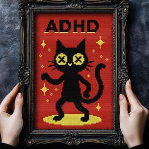 Peut inclure: Tableau encadré avec un chat noir aux yeux barrés et le mot "ADHD" en texte pixélisé sur fond rouge. Le chat est sur une surface jaune, entouré d'étoiles jaunes, dans un cadre noir orné.