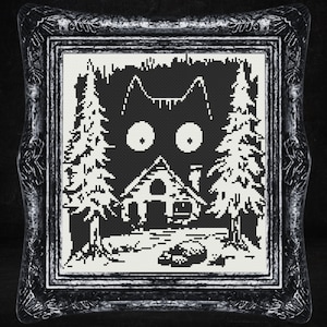 May include: Black and white cross-stitch pattern of a cat's face with large eyes, a small house, and trees in the background.