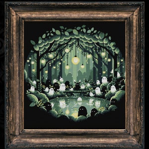 May include: A framed cross-stitch artwork depicting a whimsical forest scene with glowing lights and a gathering of ghosts around a pond. The forest is dark green with a circular frame.