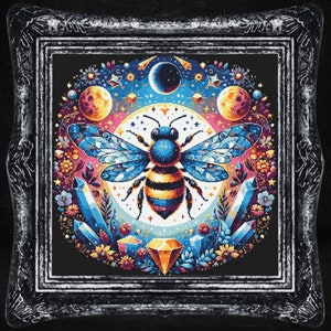May include: A colorful illustration of a bee surrounded by crystals, moons, and stars. The bee is in the center of the image and has a yellow and black striped body with blue wings. The background is black with a variety of colors and shapes.