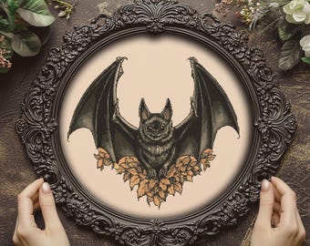 Può includere: Un pipistrello nero con le ali spiegate e un disegno floreale marrone e arancione intorno. Il pipistrello è in una cornice nera ornata.