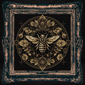 May include: A gold bee with intricate wings and a geometric pattern is surrounded by a circular design of leaves, flowers, and other botanical elements. The design is framed in a dark wood frame with gold accents.